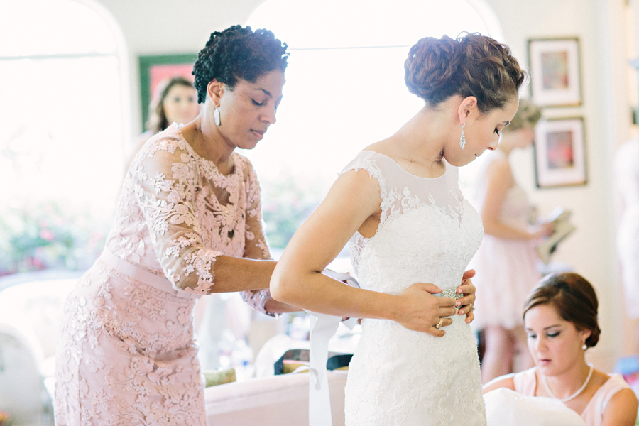 bride getting ready with mom