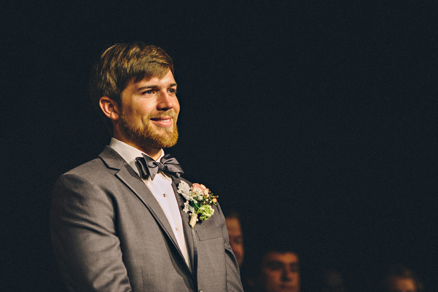 groom looking at bride