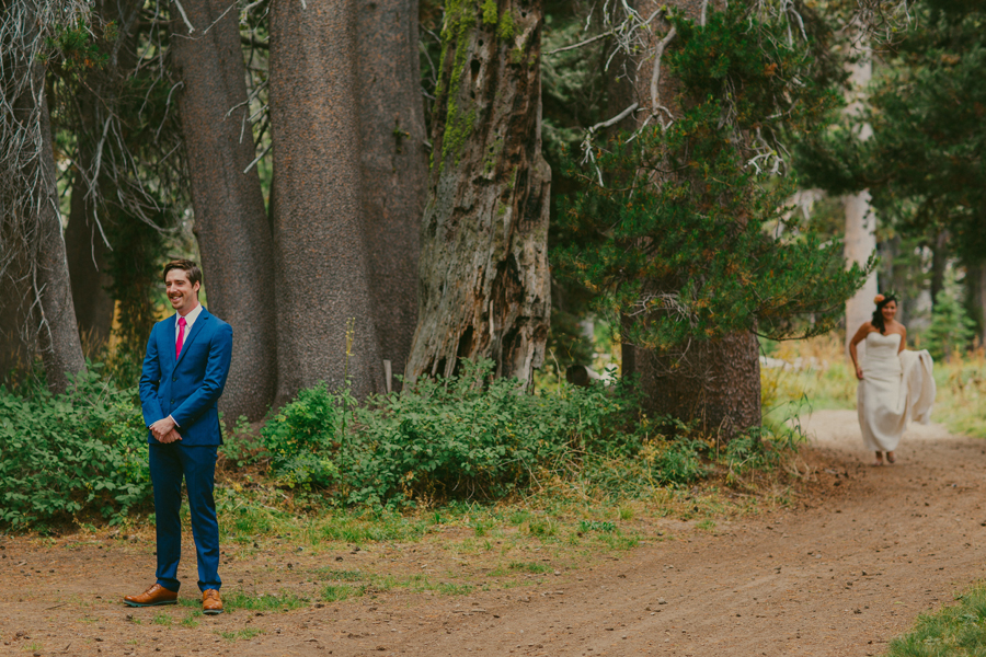 bride and groom first look in the woods